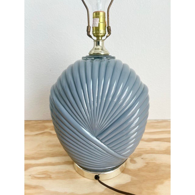 Add a touch of elegance to your living space with this beautiful vintage 1980s Art Deco table accent lamp. The lamp...
