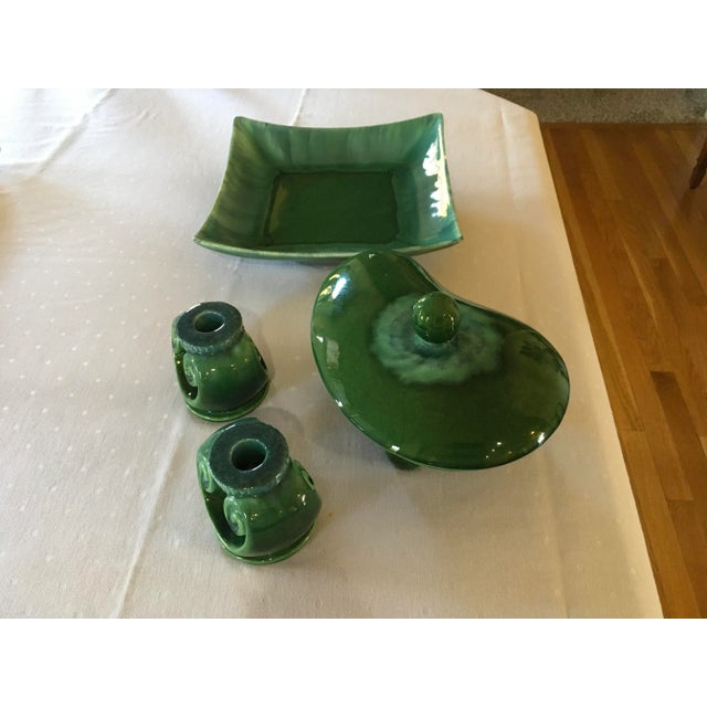 Mid-Century Modern matching pottery set of fruit bowl, candlesticks, and covered candy dish in great condition. Lovely...