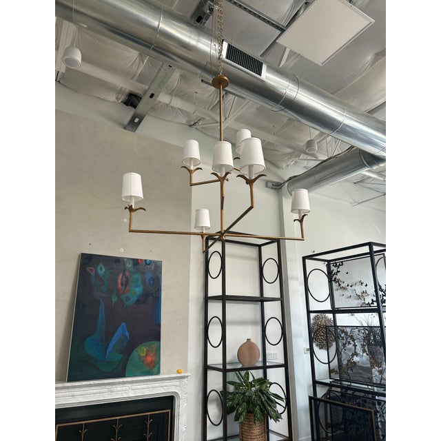 The Lily Stems Chandelier has a classic profile that fits almost any style and has great scale. The six slender arms emit...