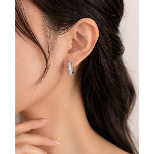 18K White Gold Odelia Diamond Hoop Earrings. These luxurious hoops feature numerous brilliant round white diamonds...