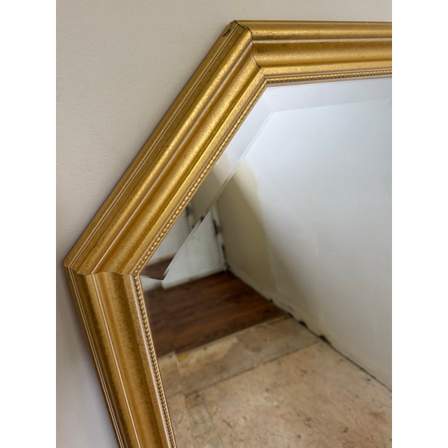 This listing is for a large, solid gilt wood octagon beveled glass wall mirror by Carolina Mirror Company. This is a...