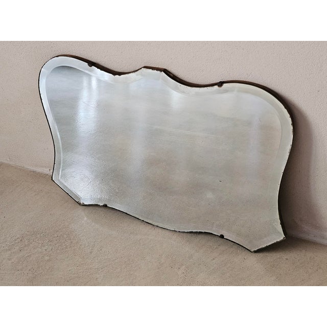 Shaped beveled glass mirror, circa 1930s, mounted with small hands on a wooden base, rear chain for hanging, ideal for...