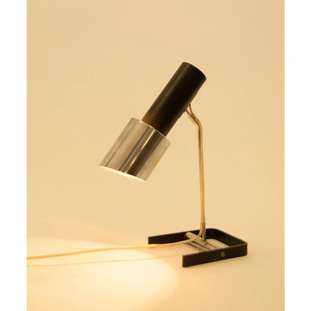 A metal reading lamp type n55 manufactured in the seventies in the czechoslovakian national enterprise kovona. The lamp is...
