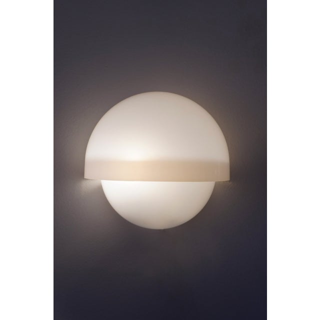 Vintage Italian "Mania" wall lamps with white opal polycarbonate lampshades mounted on a white metal frame / Made in...