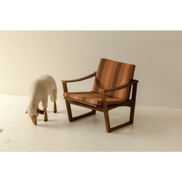 Lounge chair, model 65, designed by M. Nissen and produced by Pastoe in the Netherlands around 1960. This chair is...