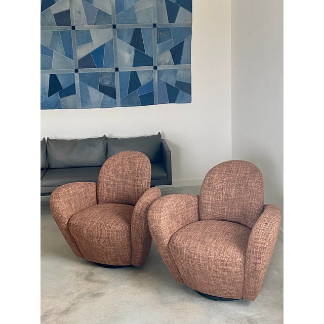 A pair of Michael Wolk-designed "Miami" chairs. This beautiful set of swivel chairs were designed by Miami-based New York...
