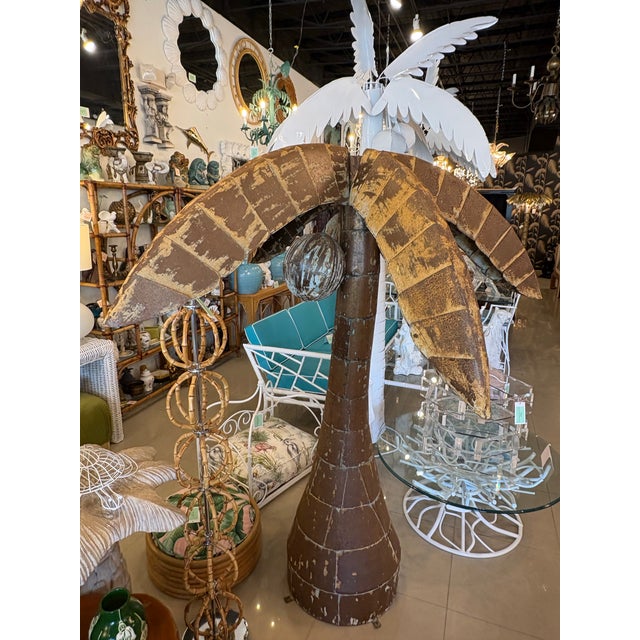 Vintage metal palm tree with 3 coconuts. Can be bolted or tied down with the bottom brackets that are on the base. Please...
