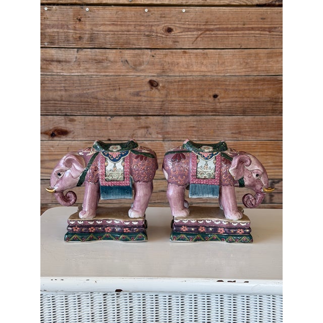 A striking pair of Chinese export porcelain elephant figures beautifully decorated in the famille rose palette with rich...