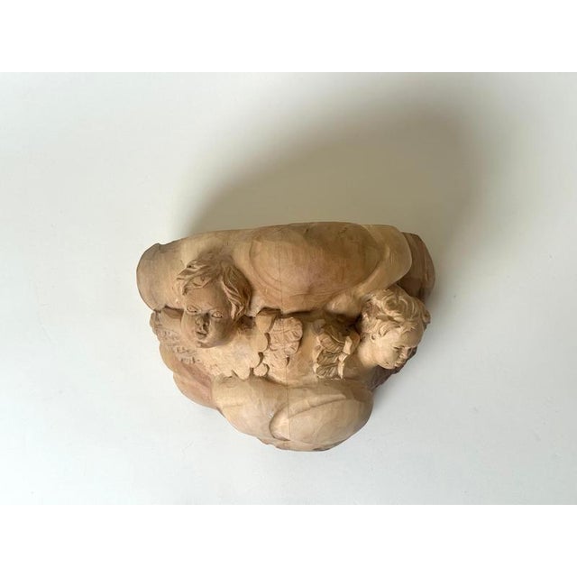 Beautiful hand-carved wall console crafted in the Baroque manner, featuring two finely sculpted angel heads emerging from...