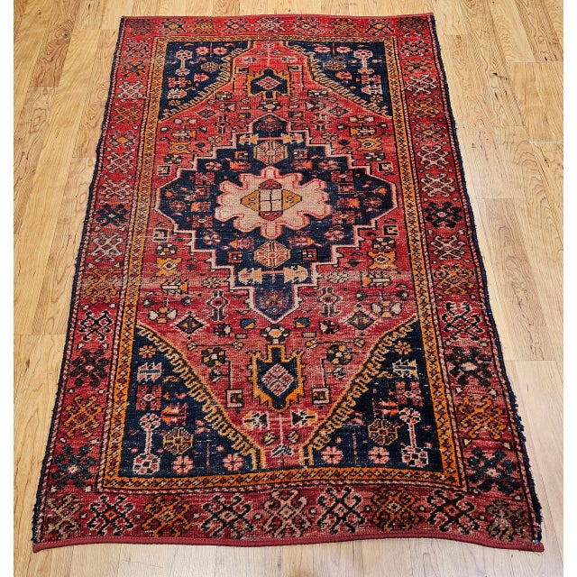 "This stunning early 20th century Persian Malayer area rug showcases village weaving at its most refined — a richly...