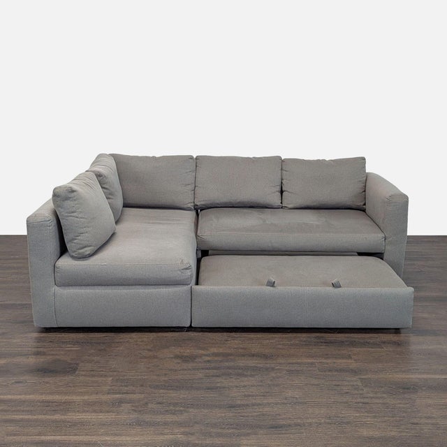 This Room & Board sectional features a modern gray fabric and clean lines, making it easy to match with any decor. It has...