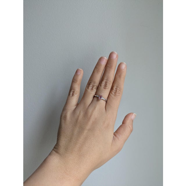 This beautiful ring features a 0.50 carat oval Imperial Topaz gemstone with natural earth mined diamonds set in solid 14K...