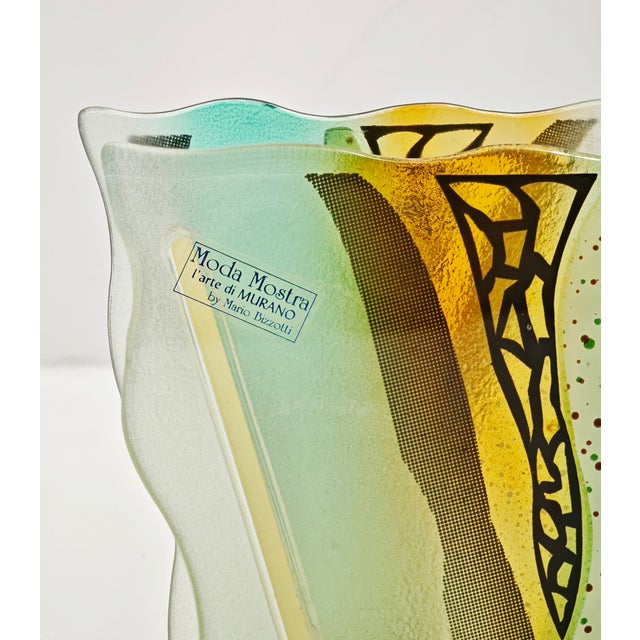 Murano glass vase "moda mostra" by mario bizzotti. it features a contemporary design with wavy edges and a satin and...
