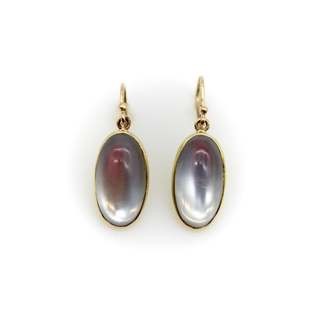 Part of Kirsten’s Corner Signature Collection, these 14k gold dangle earrings feature elongated oval Edwardian moonstone...