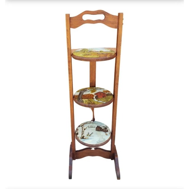 A beautiful three tier hand painted muffin stand. True oil paint on wood. Measure 12.5" in diameter and stands 35.5" tall....