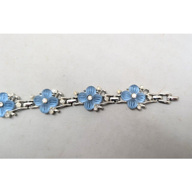1950s rhodium plated molded blue glass flowers with round clear rhinestone centers and accents link bracelet with fold...