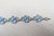 1950s rhodium plated molded blue glass flowers with round clear rhinestone centers and accents link bracelet with fold...