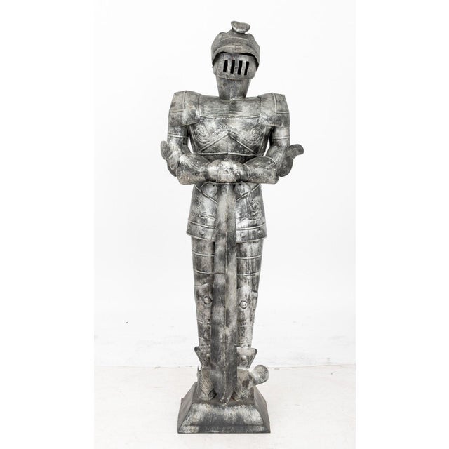 Painted Tin Knight in Armor Sculpture, standing figure holding sword, on square base. 49" H x 17.5" W x 11" D. Provenance:...