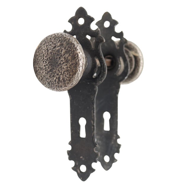 Arts & Crafts style passage door knob set made of cast iron with a black and steel finish. The original mounting screws...