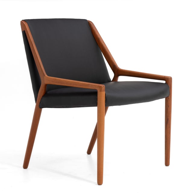 A single teak and leather occasional or lounge chair by Ejner Larsen and Aksel Bender Madsen for Willy Beck. Made in...