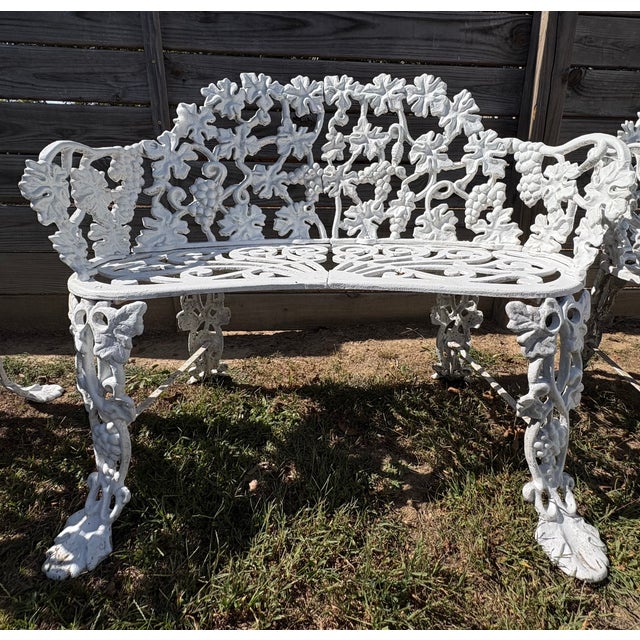 Beautiful vintage cast aluminum garden furniture set featuring intricate grapevine and grape-cluster detailing, ornate...