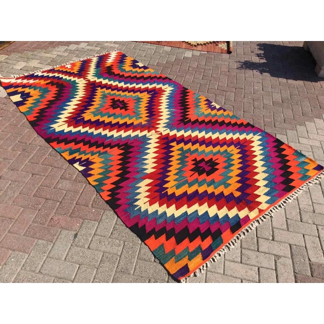 This beautiful, vintage, handwoven kilim is approximately 60 years old. It is handmade, of very fine quality hand spun...