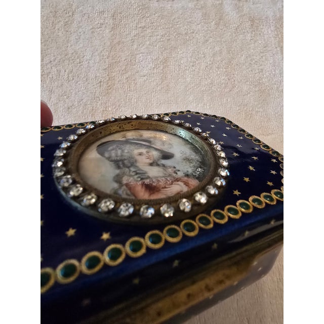 A museum quality antique faberge style double jewelled enamel jewelry box with a signed handpainted miniature painting on...