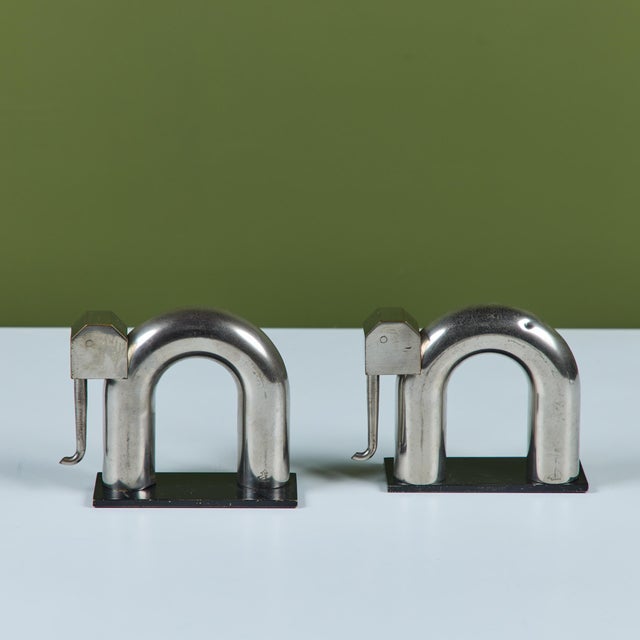 Pair of chrome bookends by Walter von Nessen for Chase, c.1930s, USA. The pair of bookends feature two chrome plated brass...