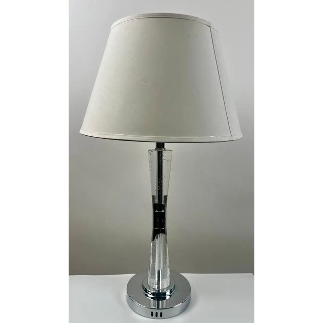 Modern Glass Column Table Lamp with Chrome Base and White Shade This sleek and contemporary table lamp features a...