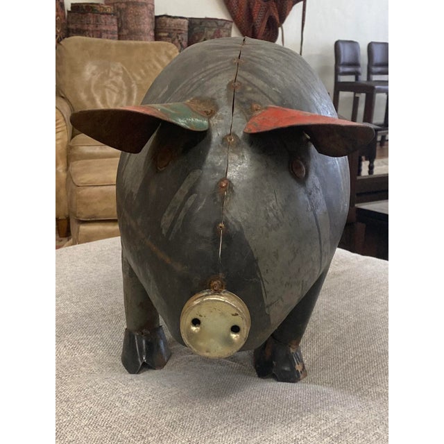 The pig brings a smile to my face. Full of character and interesting details. Made in France with reclaimed metals....