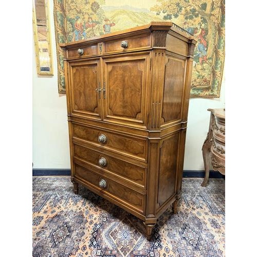 Beautiful solid walnut commode chest by Karges featuring an elegant Regency design. The piece is raised on tapering legs...