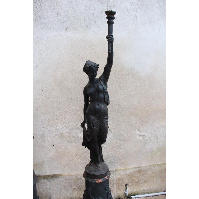 Exquisite and rare pair of cast iron torchères from the Louis Gasne foundry in Tusay 19th century, depicting Stella and...