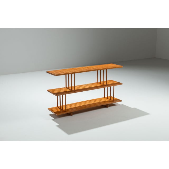 This vintage three tier shelving unit is a refined example of functional design elevated by thoughtful craftsmanship. Made...