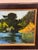 Design Plus Gallery presents an Original Lakeside Landscape Oil Painting by artist Camhi. The composition depicts calm...