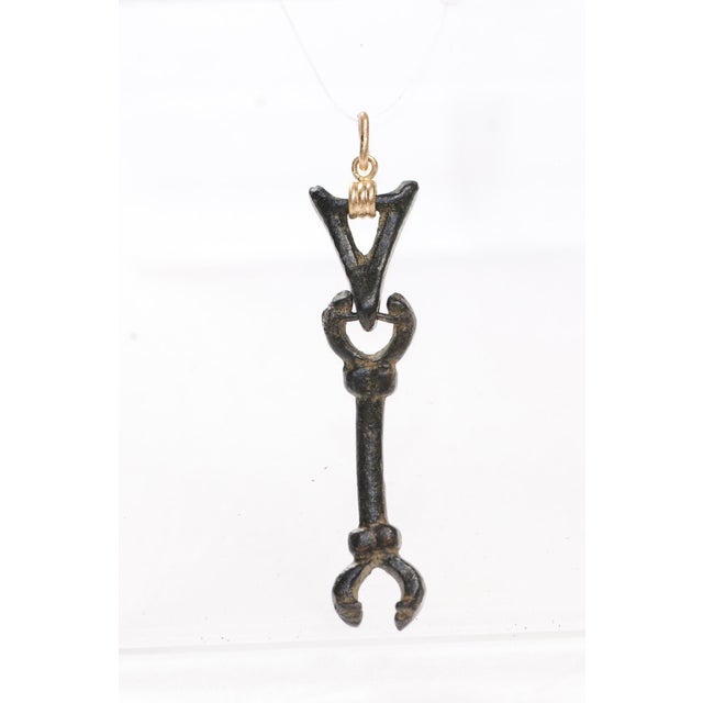 A truly unique ancient Roman artifact fashioned into a pendant with an 18 karat gold bail. The metal of this relic is soft...
