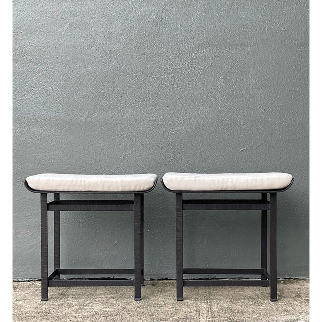 This pair of vintage modernist stools features robust metal frames and neatly tailored upholstered seats, crafted with a...