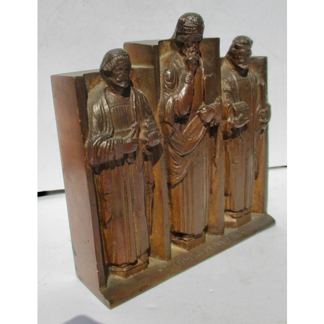 Art Deco revival of Gothic Church Imagery. The three fathers stand in a row with emblems of their authority and mastery....