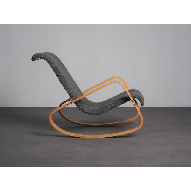 A distinctive dondolo rocking chair designed by luigi crassevig for crassevig in the 1970s. The flowing bentwood frame...