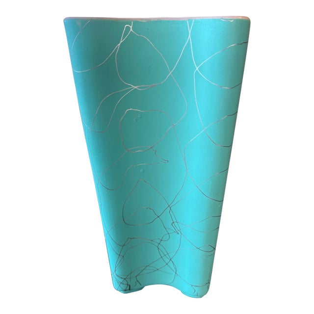 Shawnee pottery with 'clover leaf' motif, in teal and in peach. Each vase has a silver abstract design.