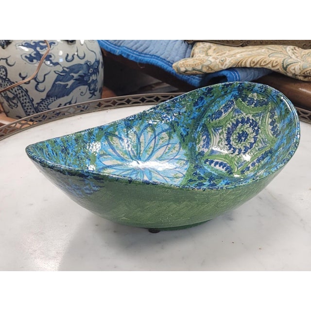MCM ceramic bowl made in Italy and signed Raymor for the American market. It measures 13 inches long by 10 inches wide by...