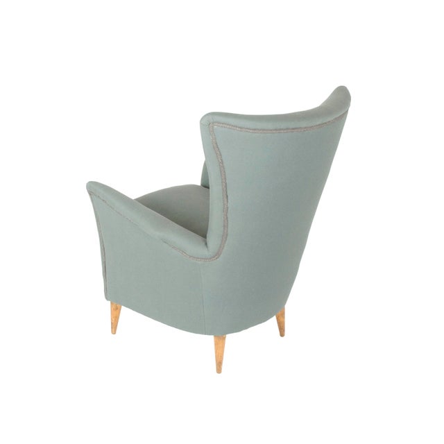 This beautiful vintage armchair was produced in the style of Gio Ponti and Carlo de Carli around 1950s. It features four...