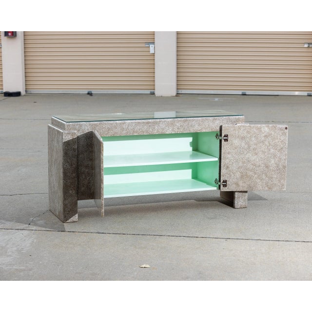 Vintage Postmodern credenza in the spirit of Memphis style design. Features a sculptural textured finish, clean geometric...