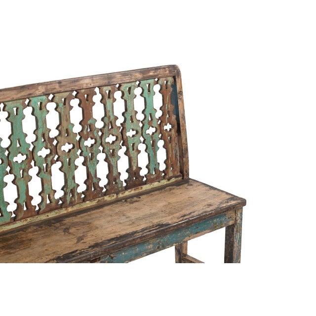 This Vintage Indian Painted Teakwood Bench features an intricately carved openwork back and layers of softly weathered...