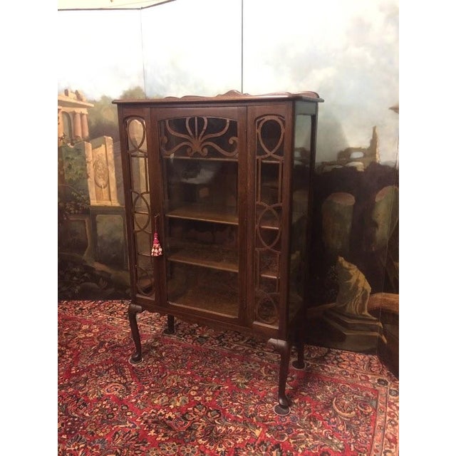 Item: Antique Oak China Cabinet with wavy glass. Age & Condition: Circa 1910-1920. Good, some signs of age and use....