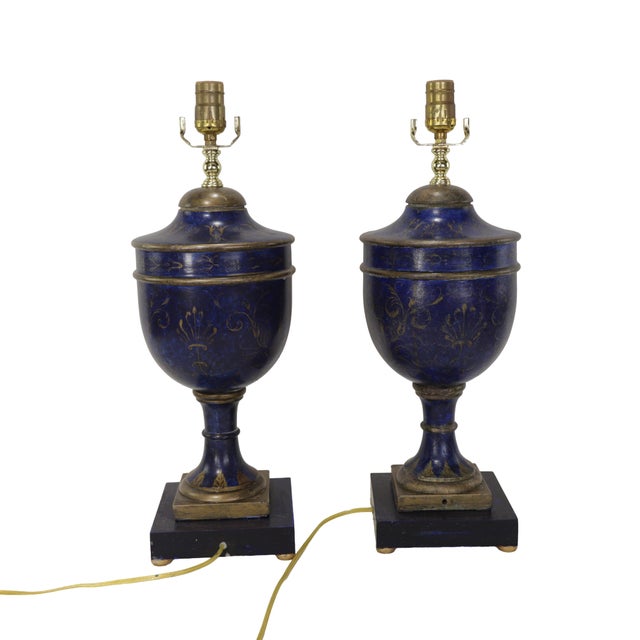 These are a pair of highly collectible, hand-painted wooden trophy table lamps. the circular window at the center of the...