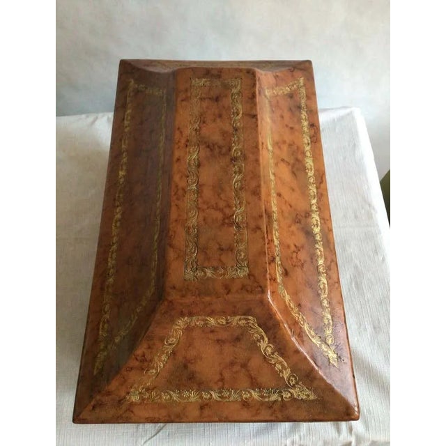1960s Italian Wood Box Covered In Leather With Tooled Gold Leaf Accents Tooled border designs accent the various shapes of...