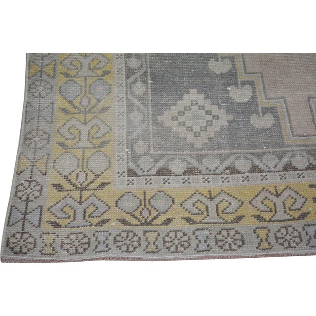 Hand-knotted with care using traditional rug-making techniques, this wool rug blends timeless craftsmanship with a modern...