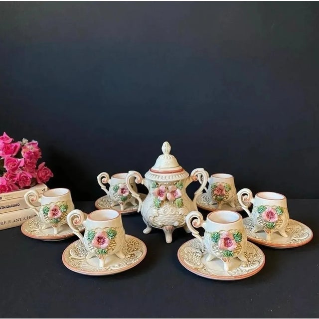 Capodimonte coffee service for 6 people. Consisting of 6 cups with saucer and sugar bowl. The service is made of ceramic....