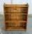 This antique pine bookcase features simple open shelving, a plank-style back, and a warm honey-toned finish that...