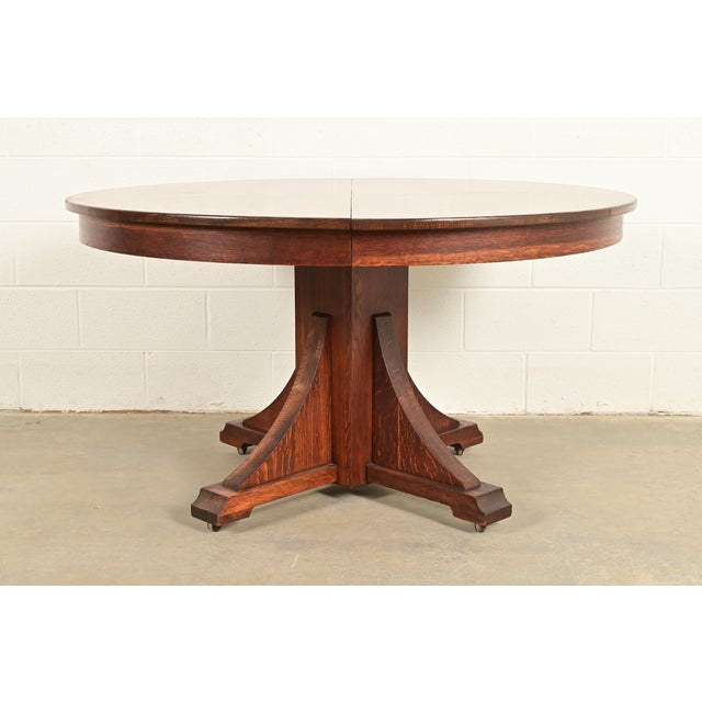 An exceptional antique Mission oak Arts & Crafts pedestal extension dining table By Stickley Brothers USA, Circa 1910...